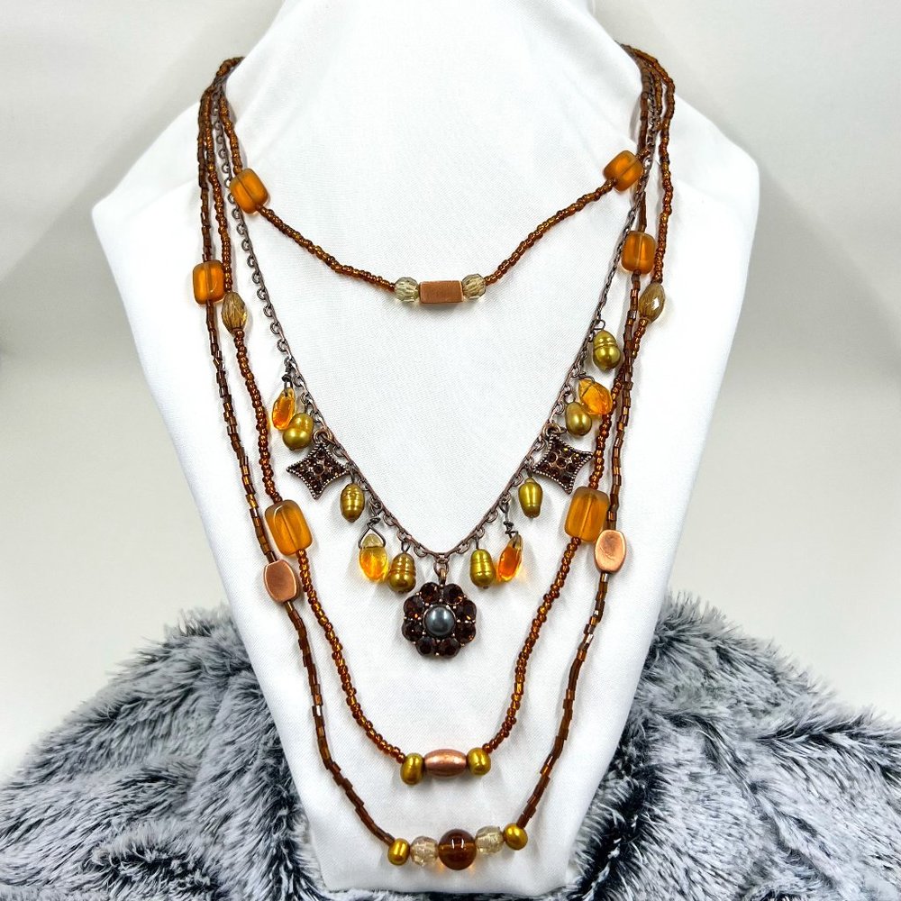 Copper Toned 4 Strand Beaded 24” Necklace with Flower Charm